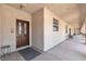 Inviting covered entry featuring a secure wooden door, textured walls, and a comfortable seating area at 825 W Ryan Ave, Overton, NV 89040