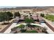 Expansive desert home boasts dual garages, mature landscaping, and circular driveway at 825 W Ryan Ave, Overton, NV 89040