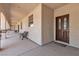 Exterior walkway with covered patio and seating, showcasing the architecture of the building at 825 W Ryan Ave, Overton, NV 89040
