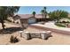 Desert home and monument sign are surrounded by mature landscaping and natural beauty at 825 W Ryan Ave, Overton, NV 89040