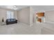 Spacious living room with tiled flooring and easy access to kitchen at 825 W Ryan Ave, Overton, NV 89040