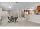 Open-concept living space with kitchen bar and tile floors, perfect for entertaining at 825 W Ryan Ave, Overton, NV 89040