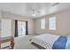 Bright main bedroom features carpet, access to the outside, and lots of natural light at 825 W Ryan Ave, Overton, NV 89040