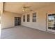 Covered patio with ceiling fan, concrete flooring, and sliding glass door at 825 W Ryan Ave, Overton, NV 89040