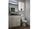 Well-lit half bathroom with a modern vanity and neutral decor at 8901 Kingswood Dr, Las Vegas, NV 89147