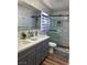 Bright bathroom with double sinks, white marble walls, and a glass-enclosed shower at 8901 Kingswood Dr, Las Vegas, NV 89147