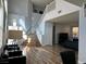 Bright foyer featuring a staircase, views into the living room, and stylish decor at 8901 Kingswood Dr, Las Vegas, NV 89147