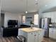 Modern kitchen featuring an island with pendant lighting and stainless steel appliances at 8901 Kingswood Dr, Las Vegas, NV 89147