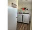 Convenient laundry room equipped with a modern washer and dryer, perfect for easy and efficient laundry care at 8901 Kingswood Dr, Las Vegas, NV 89147