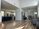 Bright living area featuring an open concept design, modern furniture, and stylish hardwood floors at 8901 Kingswood Dr, Las Vegas, NV 89147