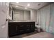 Bathroom with double sinks, granite countertop, and a decorative shower curtain at 9015 Chopper Prairie St, Las Vegas, NV 89131