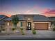 Charming single-story home featuring a well-manicured front yard and a spacious two-car garage at 9015 Chopper Prairie St, Las Vegas, NV 89131
