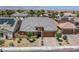 Well-maintained home featuring desert landscaping, a brick-paved driveway, and solar panels at 9015 Chopper Prairie St, Las Vegas, NV 89131