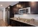Well-appointed kitchen featuring stainless steel appliances, granite countertops, and ample cabinet space at 9015 Chopper Prairie St, Las Vegas, NV 89131