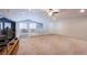 Spacious loft area with carpet flooring and a white railing overlooking the lower level at 9015 Chopper Prairie St, Las Vegas, NV 89131