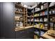 Organized walk-in pantry with custom shelving and cabinetry, perfect for storing food and kitchen essentials at 9015 Chopper Prairie St, Las Vegas, NV 89131