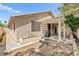 The backyard is shaded with mature landscaping and a covered patio at 9733 Northern Dancer Dr, Las Vegas, NV 89117