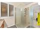 Bathroom walk-in shower with glass door and view of the main bedroom at 9733 Northern Dancer Dr, Las Vegas, NV 89117