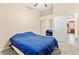 This bedroom has carpet, a ceiling fan, and access to a bathroom at 9733 Northern Dancer Dr, Las Vegas, NV 89117