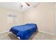 This bedroom has carpet, a ceiling fan, and a window with blinds at 9733 Northern Dancer Dr, Las Vegas, NV 89117