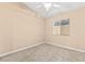 This bedroom has carpet, a ceiling fan, and a window with blinds at 9733 Northern Dancer Dr, Las Vegas, NV 89117