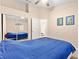 Bright bedroom features large mirrored closet and fresh neutral color palette at 9733 Northern Dancer Dr, Las Vegas, NV 89117