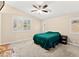 Cozy bedroom with large windows, providing ample natural light and creating a relaxing atmosphere at 9733 Northern Dancer Dr, Las Vegas, NV 89117