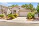 Charming single-story home with a well-maintained lawn, mature landscaping, and a two-car garage at 9733 Northern Dancer Dr, Las Vegas, NV 89117