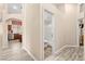 Bright hallway leading to the kitchen and the bathroom at 9733 Northern Dancer Dr, Las Vegas, NV 89117