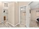 Well-lit hallway with neutral tones, connecting various rooms, providing a seamless transition throughout the home at 9733 Northern Dancer Dr, Las Vegas, NV 89117