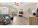 Sun-filled living room with vaulted ceilings, shuttered windows, and neutral decor at 9733 Northern Dancer Dr, Las Vegas, NV 89117