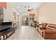 Spacious living room featuring vaulted ceilings, fireplace, and sliding glass doors to the backyard at 9733 Northern Dancer Dr, Las Vegas, NV 89117