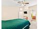 This main bedroom has carpet, a ceiling fan, and bathroom access at 9733 Northern Dancer Dr, Las Vegas, NV 89117