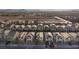 An aerial view of a residential neighborhood with mountain views at 10347 Restless River St, Las Vegas, NV 89141