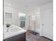 Modern bathroom with a glass-enclosed shower and a dark wood vanity at 10347 Restless River St, Las Vegas, NV 89141