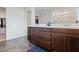Bright bathroom with a double vanity, tile flooring, and a large walk-in closet at 10347 Restless River St, Las Vegas, NV 89141