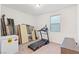 A spare bedroom featuring a treadmill and extra storage space at 10347 Restless River St, Las Vegas, NV 89141