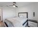 Bright bedroom features a ceiling fan and neutral carpeting at 10347 Restless River St, Las Vegas, NV 89141