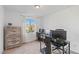 Bright bedroom with a large window, offering plenty of natural light and a pleasant view at 10347 Restless River St, Las Vegas, NV 89141