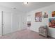 Neutral-toned bedroom featuring carpeting, white walls, and closet space at 10347 Restless River St, Las Vegas, NV 89141