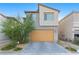 Stylish two-story home with a two-car garage and low-maintenance landscaping at 10347 Restless River St, Las Vegas, NV 89141