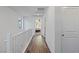 Light and bright hallway features wood-look floors and access to another bedroom at 10347 Restless River St, Las Vegas, NV 89141