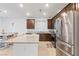 Well-equipped kitchen with stainless steel appliances and a granite-topped island at 10347 Restless River St, Las Vegas, NV 89141