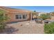 Landscaped backyard features a covered patio and low maintenance gravel at 10428 Villa Ridge Dr, Las Vegas, NV 89134