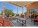 Spacious backyard with a covered patio and landscaped gravel area at 10428 Villa Ridge Dr, Las Vegas, NV 89134
