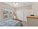 A cozy bedroom features a wooden bed frame and a window at 10428 Villa Ridge Dr, Las Vegas, NV 89134