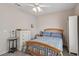 A bedroom features a wooden bed frame and a window at 10428 Villa Ridge Dr, Las Vegas, NV 89134