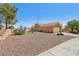 Single-story home with desert landscaping and an attached garage at 10428 Villa Ridge Dr, Las Vegas, NV 89134