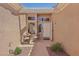 Inviting front entrance with a seating area and desert landscaping at 10428 Villa Ridge Dr, Las Vegas, NV 89134