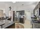 Spacious kitchen with granite countertops, stainless steel appliances, and an open layout to adjacent living areas at 10428 Villa Ridge Dr, Las Vegas, NV 89134